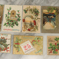 Lot 115 - Grouping Of Eight Antique And Vintage Christmas Postcards Including White Lamb, Nautical Theme, And Santa