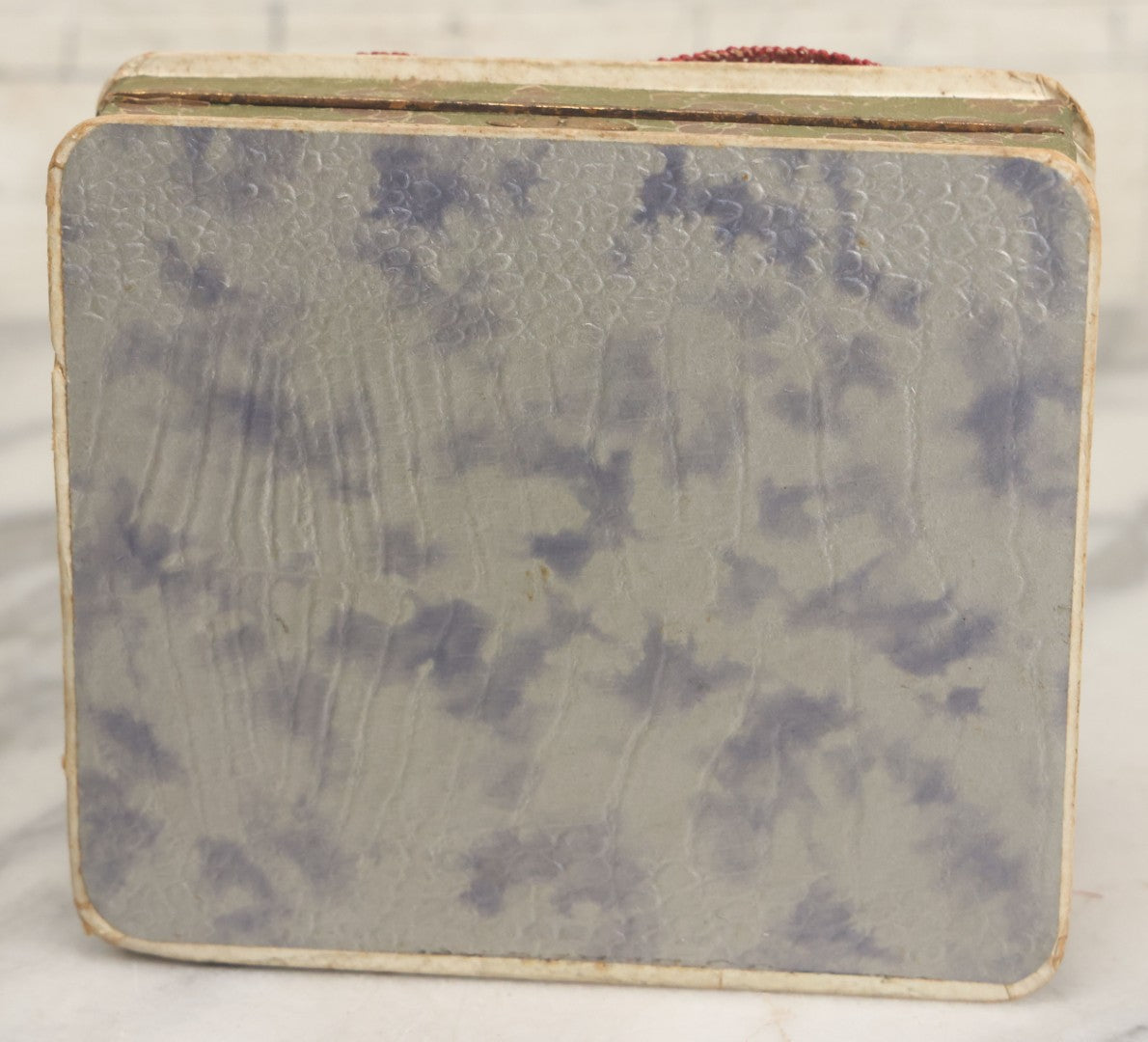 Lot 085 - Antique Paper Board Candy Box With Tufted Red Fabric, Blue Boy With Flowers Graphic On Cover