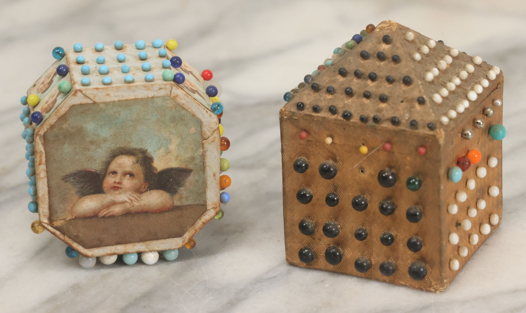 Lot 087 - Pair Of Antique Paper Board Pin Cubes, Including H.F. Neuss "Original Pin Cube" With Paper Label On Bottom, With Various Ball Head Sewing Pins 