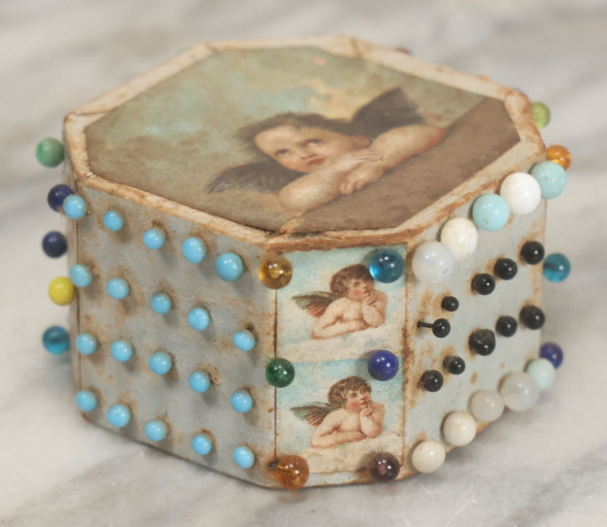 Lot 087 - Pair Of Antique Paper Board Pin Cubes, Including H.F. Neuss "Original Pin Cube" With Paper Label On Bottom, With Various Ball Head Sewing Pins 