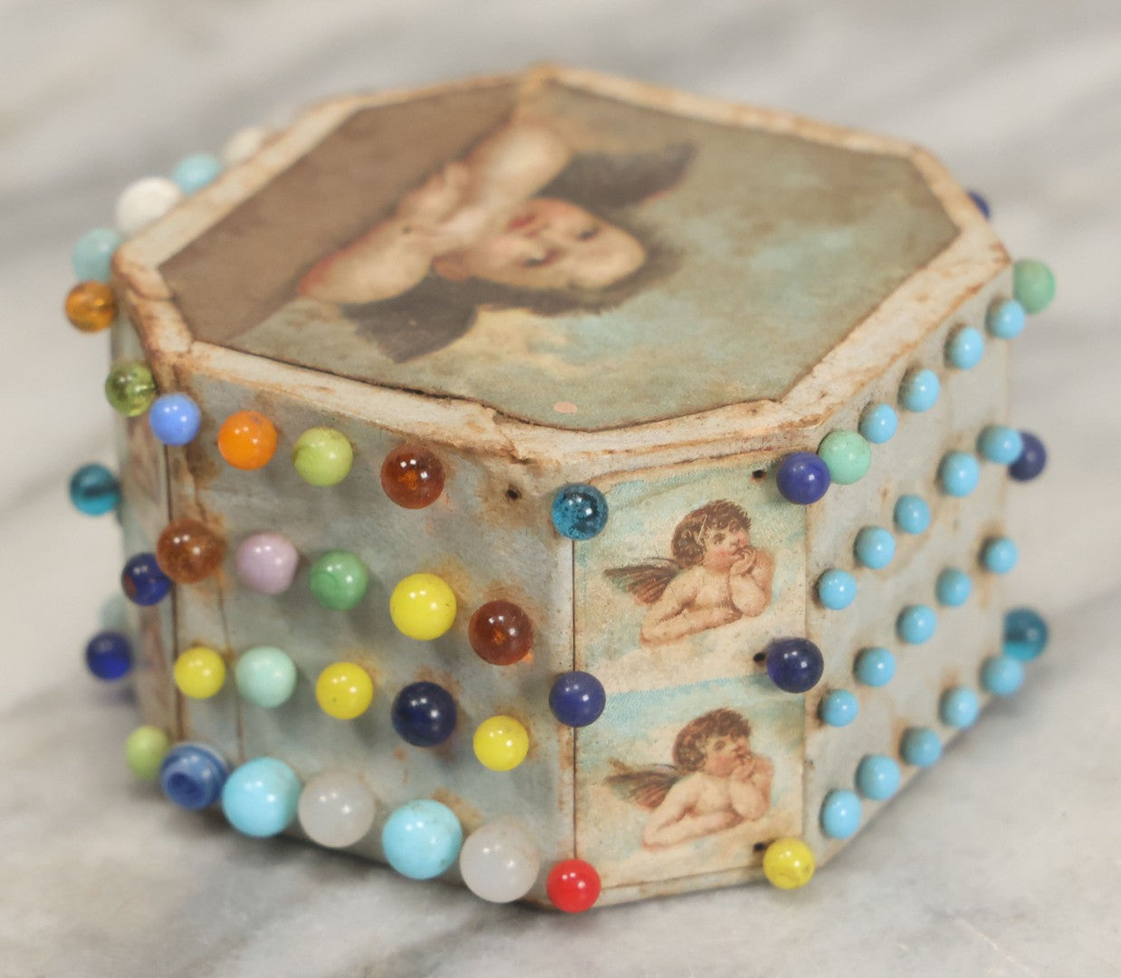 Lot 087 - Pair Of Antique Paper Board Pin Cubes, Including H.F. Neuss "Original Pin Cube" With Paper Label On Bottom, With Various Ball Head Sewing Pins 