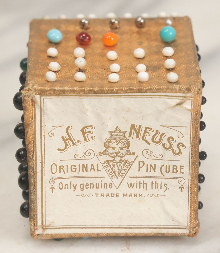 Lot 087 - Pair Of Antique Paper Board Pin Cubes, Including H.F. Neuss "Original Pin Cube" With Paper Label On Bottom, With Various Ball Head Sewing Pins 