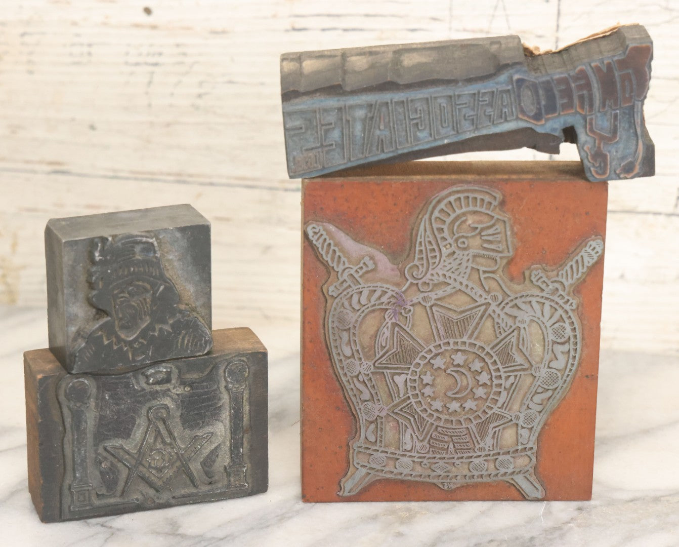 Lot 089 - Grouping Of Four Vintage Printing Blocks Including Masonic, Knights Of Columbus, Strange Hollering Man, And Tom Field Associates