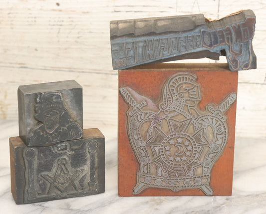 Lot 089 - Grouping Of Four Vintage Printing Blocks Including Masonic, Knights Of Columbus, Strange Hollering Man, And Tom Field Associates