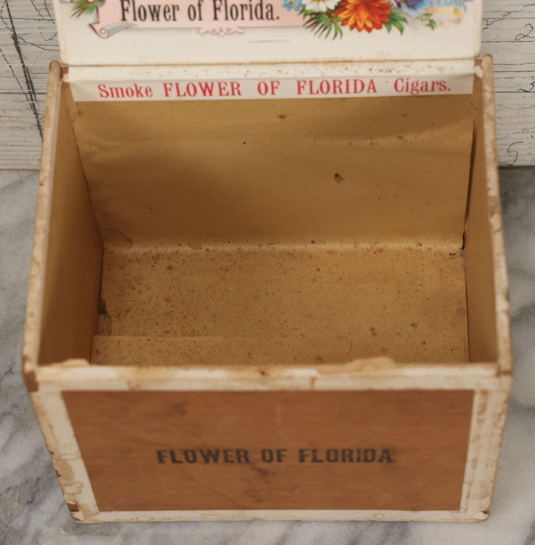 Lot 097 - Antique Wooden Cigar Box With Lithographed Label For Flower Of Florida Cigars, With Woman In Pink Hat & Lighthouse Graphics On External And Internal Labels, Paper Label From Milliken Tomlinson Company, Portland, Maine