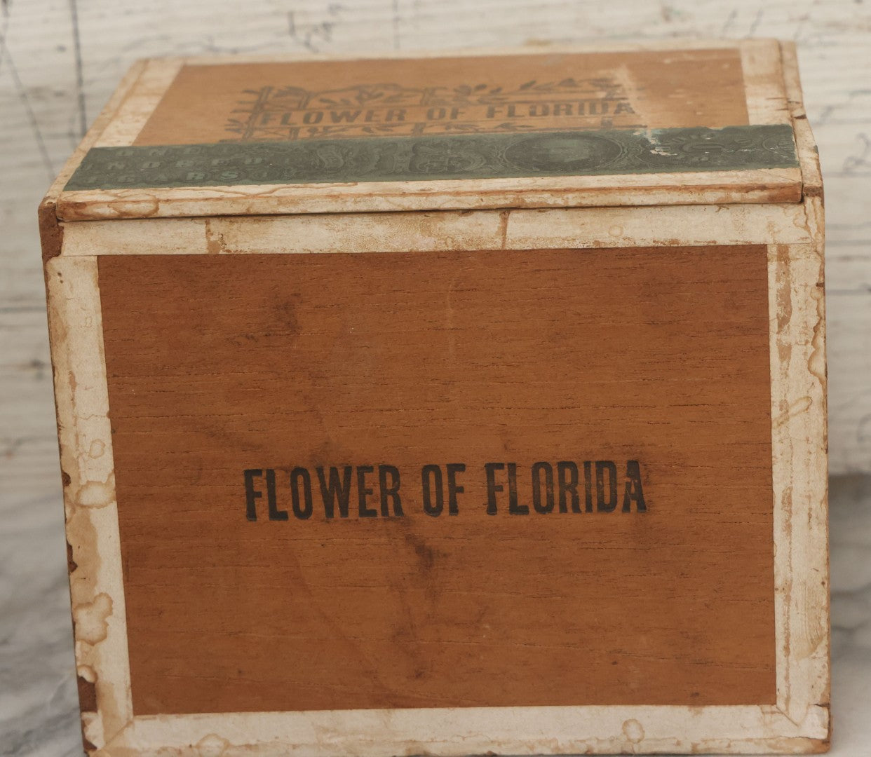 Lot 097 - Antique Wooden Cigar Box With Lithographed Label For Flower Of Florida Cigars, With Woman In Pink Hat & Lighthouse Graphics On External And Internal Labels, Paper Label From Milliken Tomlinson Company, Portland, Maine