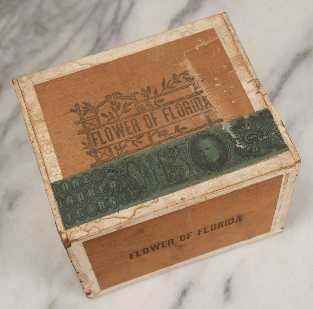 Lot 097 - Antique Wooden Cigar Box With Lithographed Label For Flower Of Florida Cigars, With Woman In Pink Hat & Lighthouse Graphics On External And Internal Labels, Paper Label From Milliken Tomlinson Company, Portland, Maine