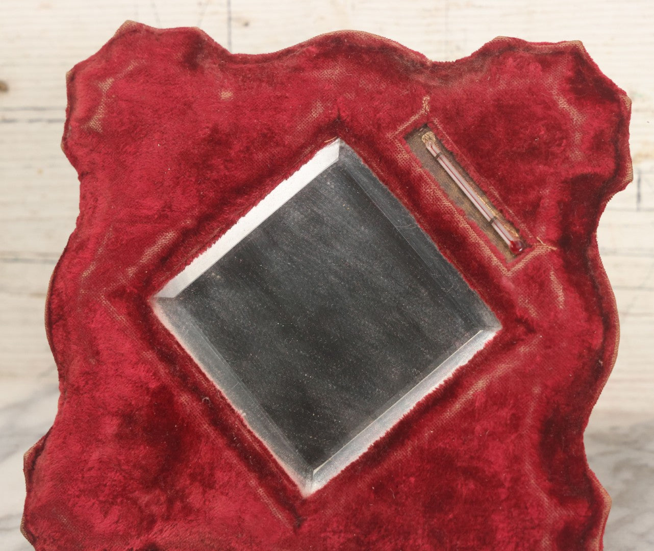 Lot 104 - Antique Beveled Dresser Mirror With Red Velvet Surround And Thermometer, Pressboard Backing, And Wire Kick Stand