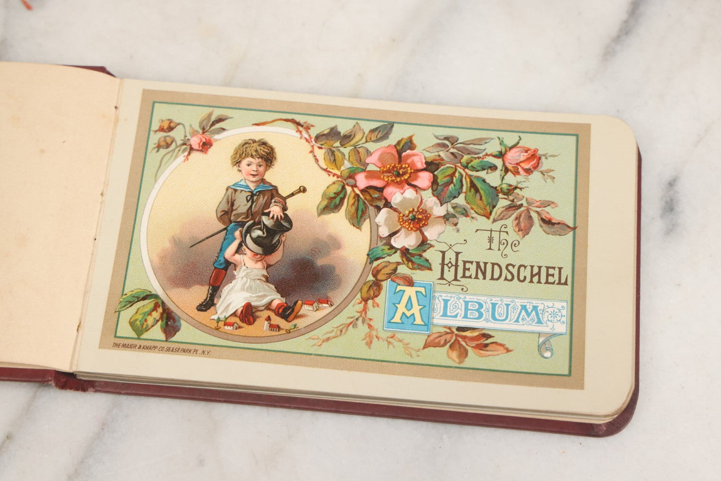 Lot 106 - Empty Antique Victorian Autograph Album, "The Hendschel Album" Published By The Major Knapp & Co., New York, With Little Girl On Cover, Gold Flowers, Seven Full Page Chromolithograph Plate Inserts