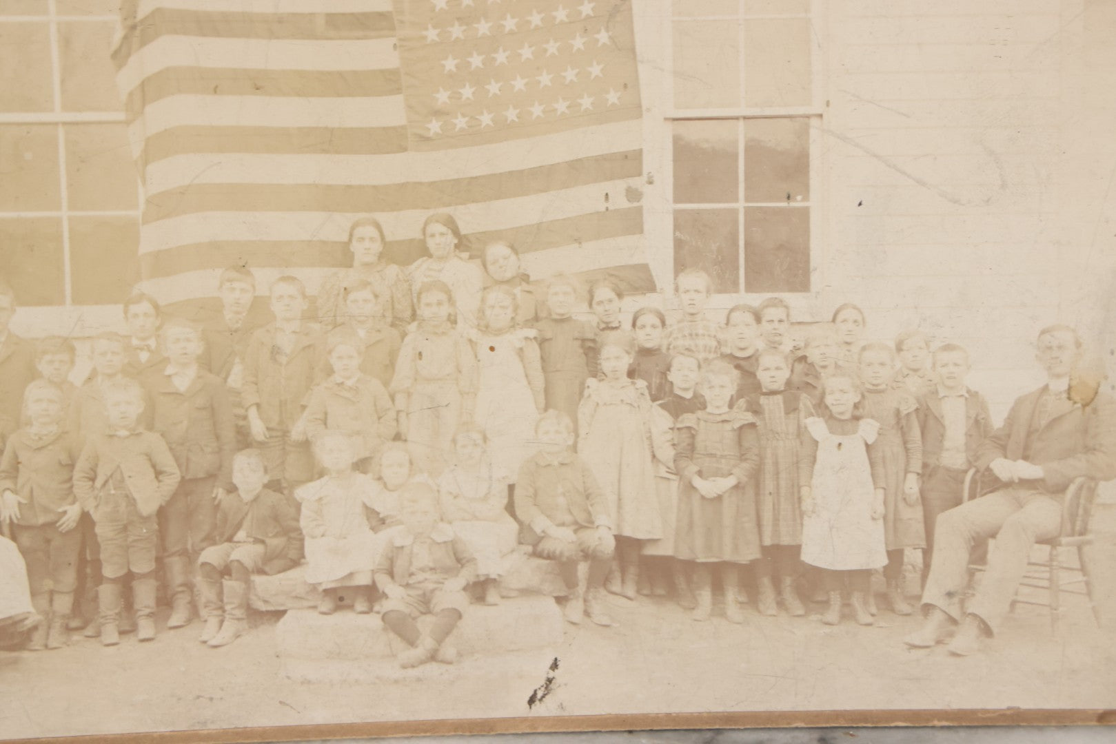 Lot 112 - Antique Boarded Photograph Of Western Pennsylvania School Class Posing In Front Of 44 Star American Flag With Teachers, Lenning & Thompson, Photographers, Martinsburg, Pennsylvania
