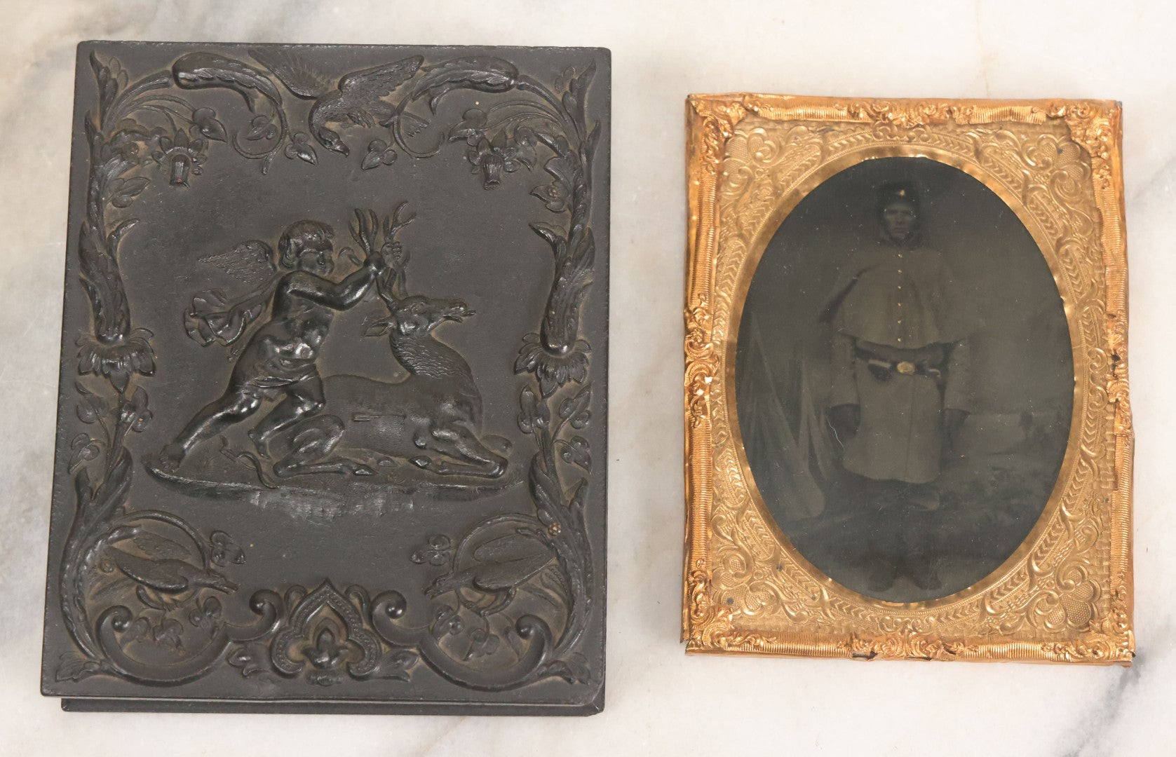 Lot 113 - Antique 1/4 Plate Tintype Photograph Of Civil War Era Soldier In Figural Thermoplastic Union Case With Cherub Battling Deer, Bird Adornments, Manufactured By Littlefield, Parsons, And Co., Note Photo Is Underexposed