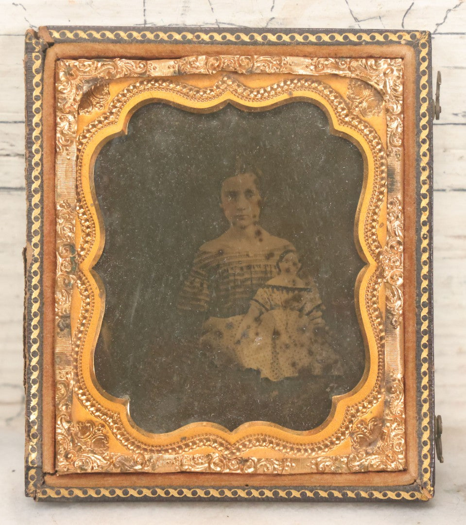 Lot 118 - Antique 1/6th Plate Ambrotype Photograph Of Young Girl In Off-The-Shoulders Dress Holding Period China Doll, Identified As Nettie L. Finch Edmonds, 1847-1936, In Full Split Leatherette Union Case