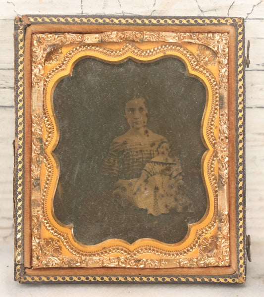 Lot 118 - Antique 1/6th Plate Ambrotype Photograph Of Young Girl In Off-The-Shoulders Dress Holding Period China Doll, Identified As Nettie L. Finch Edmonds, 1847-1936, In Full Split Leatherette Union Case