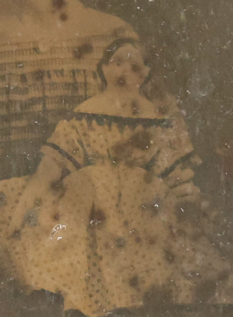 Lot 118 - Antique 1/6th Plate Ambrotype Photograph Of Young Girl In Off-The-Shoulders Dress Holding Period China Doll, Identified As Nettie L. Finch Edmonds, 1847-1936, In Full Split Leatherette Union Case