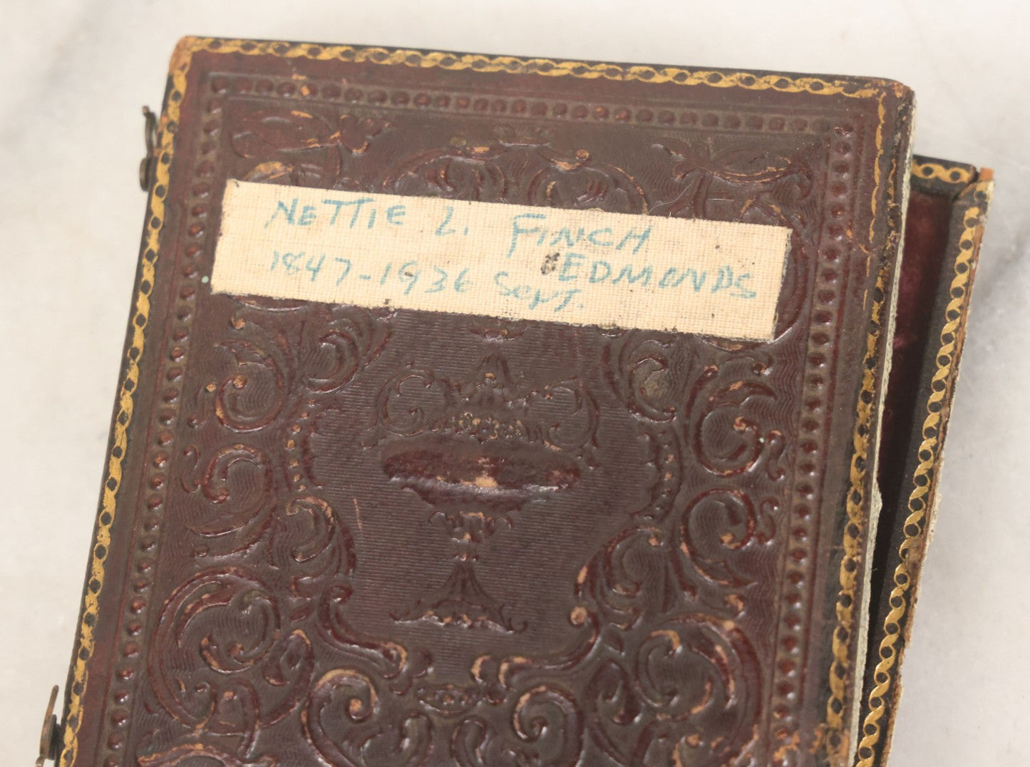 Lot 118 - Antique 1/6th Plate Ambrotype Photograph Of Young Girl In Off-The-Shoulders Dress Holding Period China Doll, Identified As Nettie L. Finch Edmonds, 1847-1936, In Full Split Leatherette Union Case