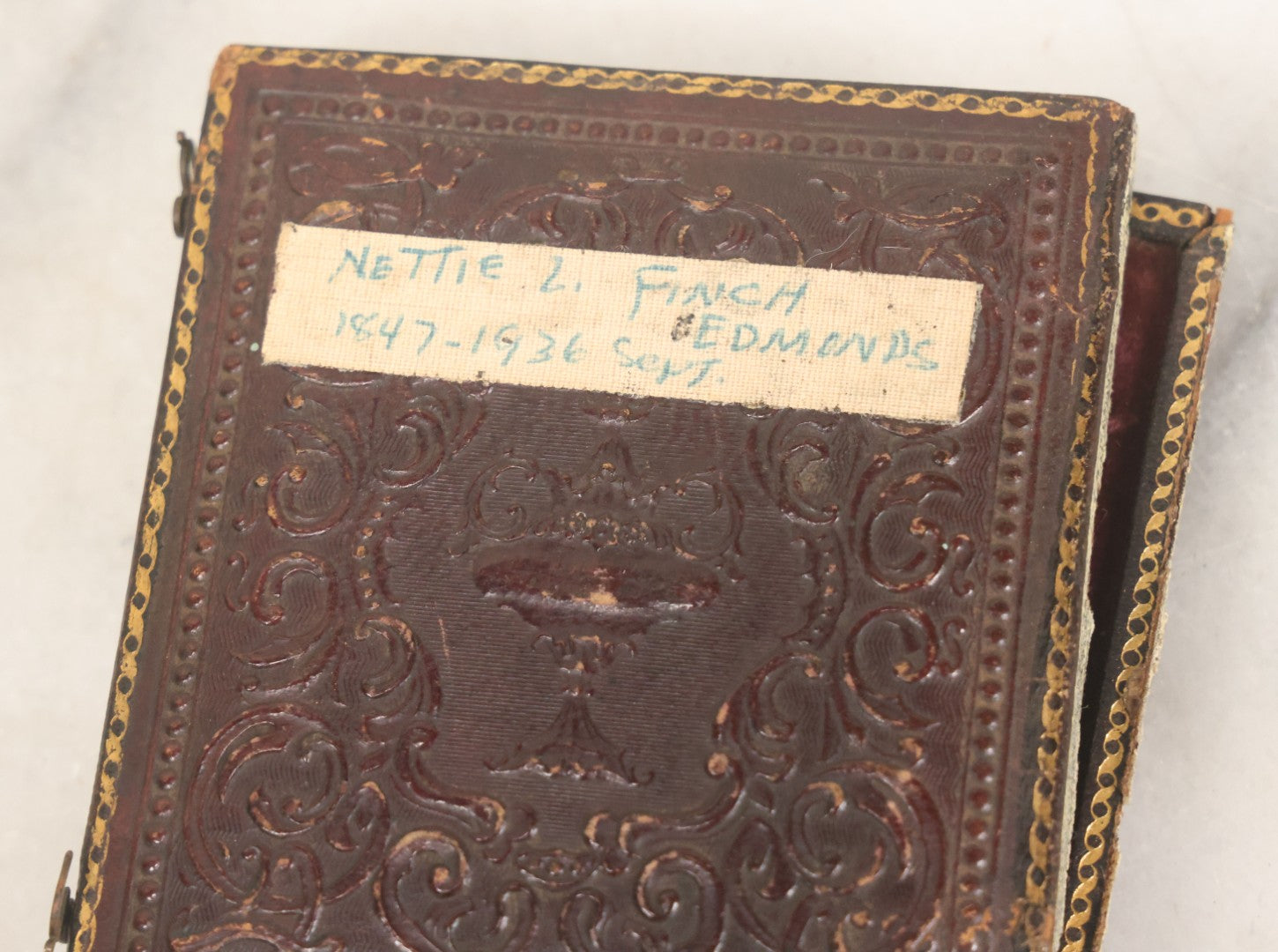 Lot 118 - Antique 1/6th Plate Ambrotype Photograph Of Young Girl In Off-The-Shoulders Dress Holding Period China Doll, Identified As Nettie L. Finch Edmonds, 1847-1936, In Full Split Leatherette Union Case