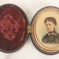 Lot 119 - Antique Color Painting Over Photograph Of Pretty Young Woman With Long Brown Hair, Dangly Earrings, In Figural Oval Thermoplastic Photo Case With Women, Baby And Dog