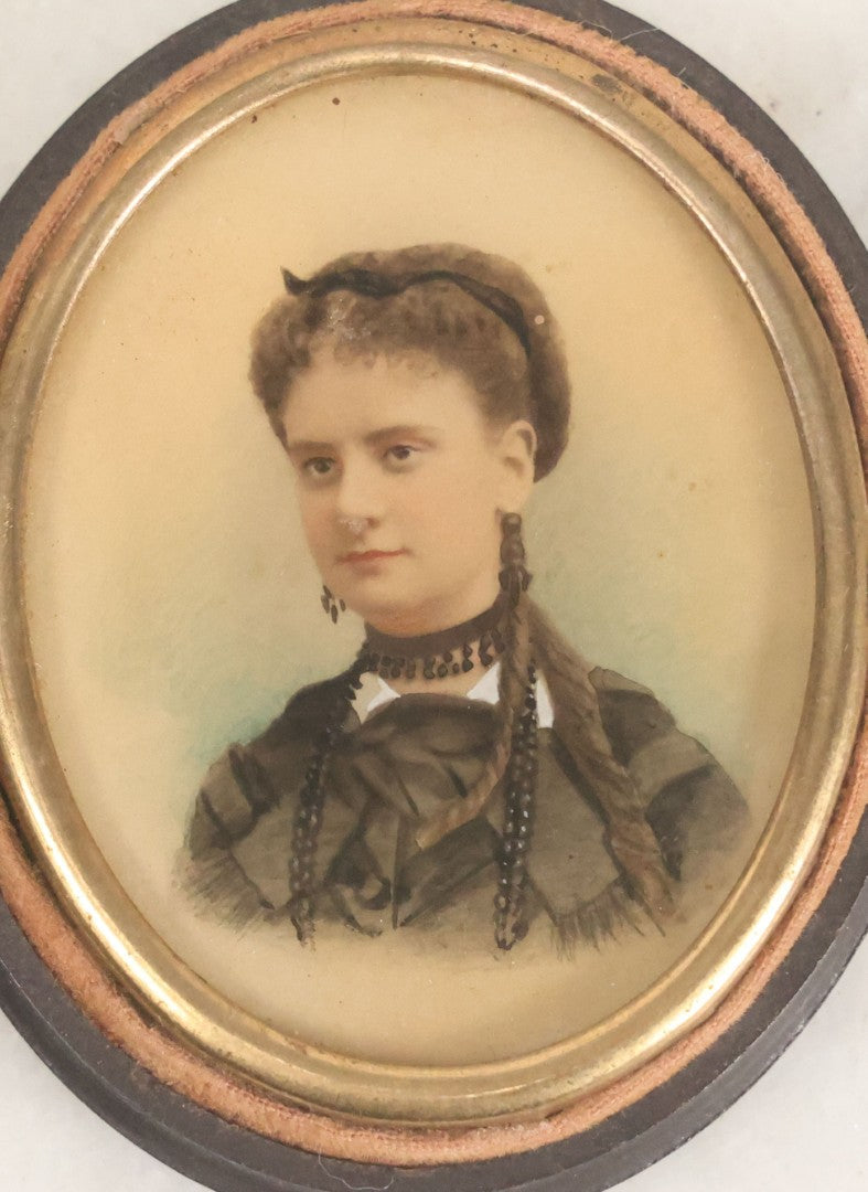 Lot 119 - Antique Color Painting Over Photograph Of Pretty Young Woman With Long Brown Hair, Dangly Earrings, In Figural Oval Thermoplastic Photo Case With Women, Baby And Dog