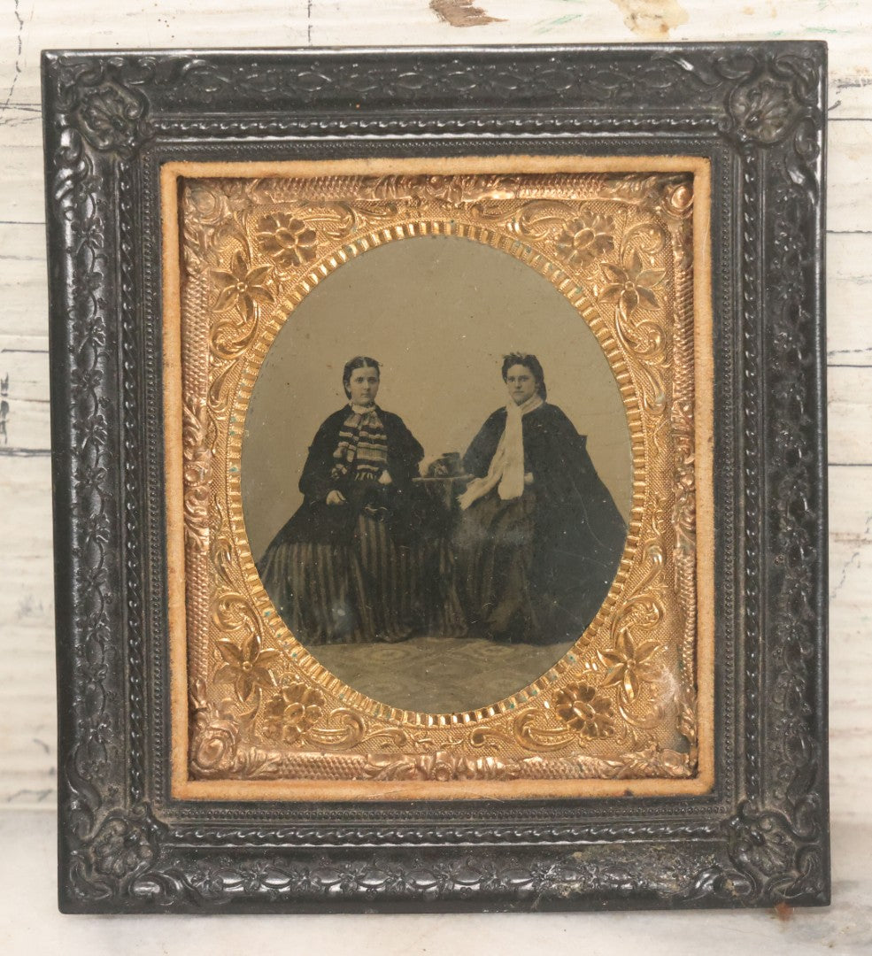 Lot 120 - Antique 1/6th Plate Tintype Photograph Of Two Ladies Seated At Table In Period Thermoplastic Frame With Hanging Hook, 4-1/8" x 4-5/8"