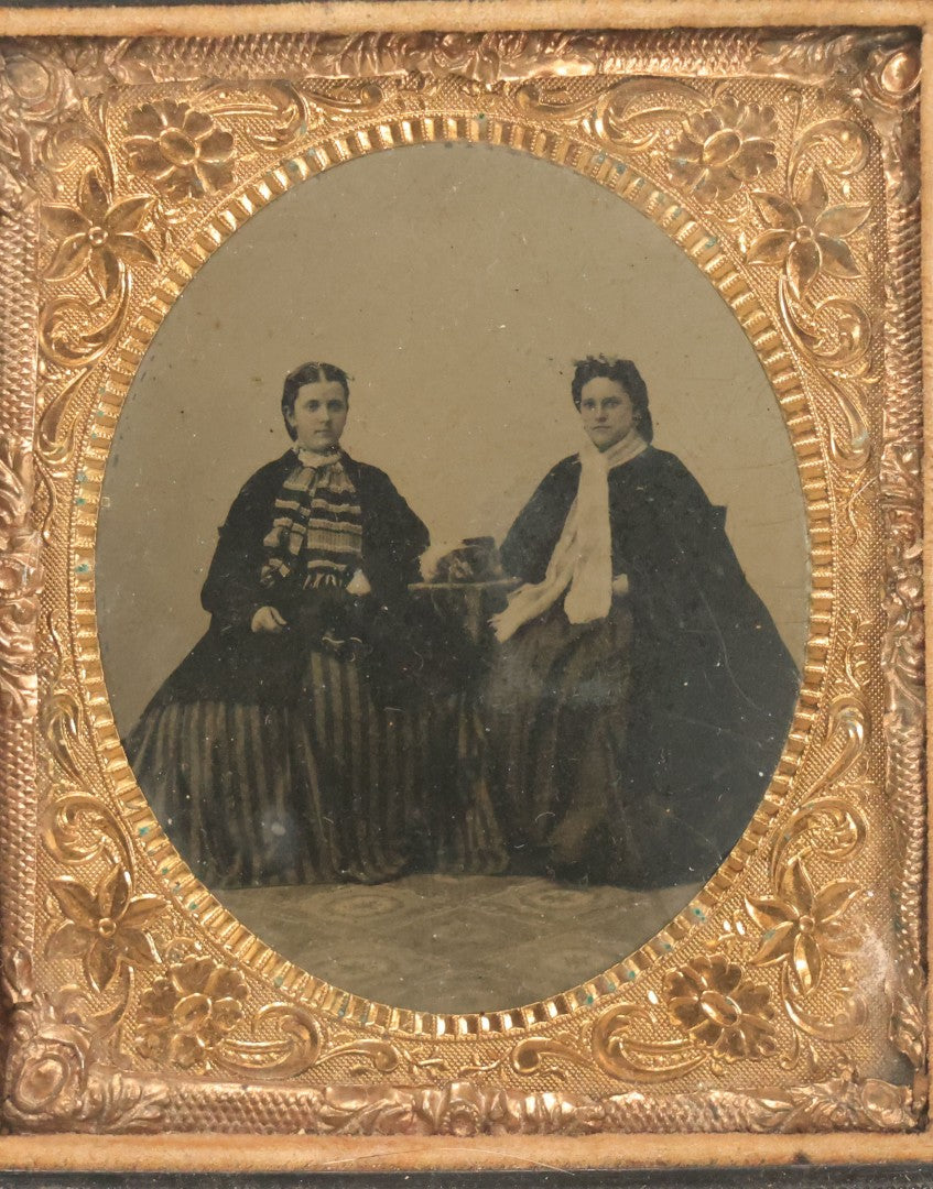 Lot 120 - Antique 1/6th Plate Tintype Photograph Of Two Ladies Seated At Table In Period Thermoplastic Frame With Hanging Hook, 4-1/8" x 4-5/8"