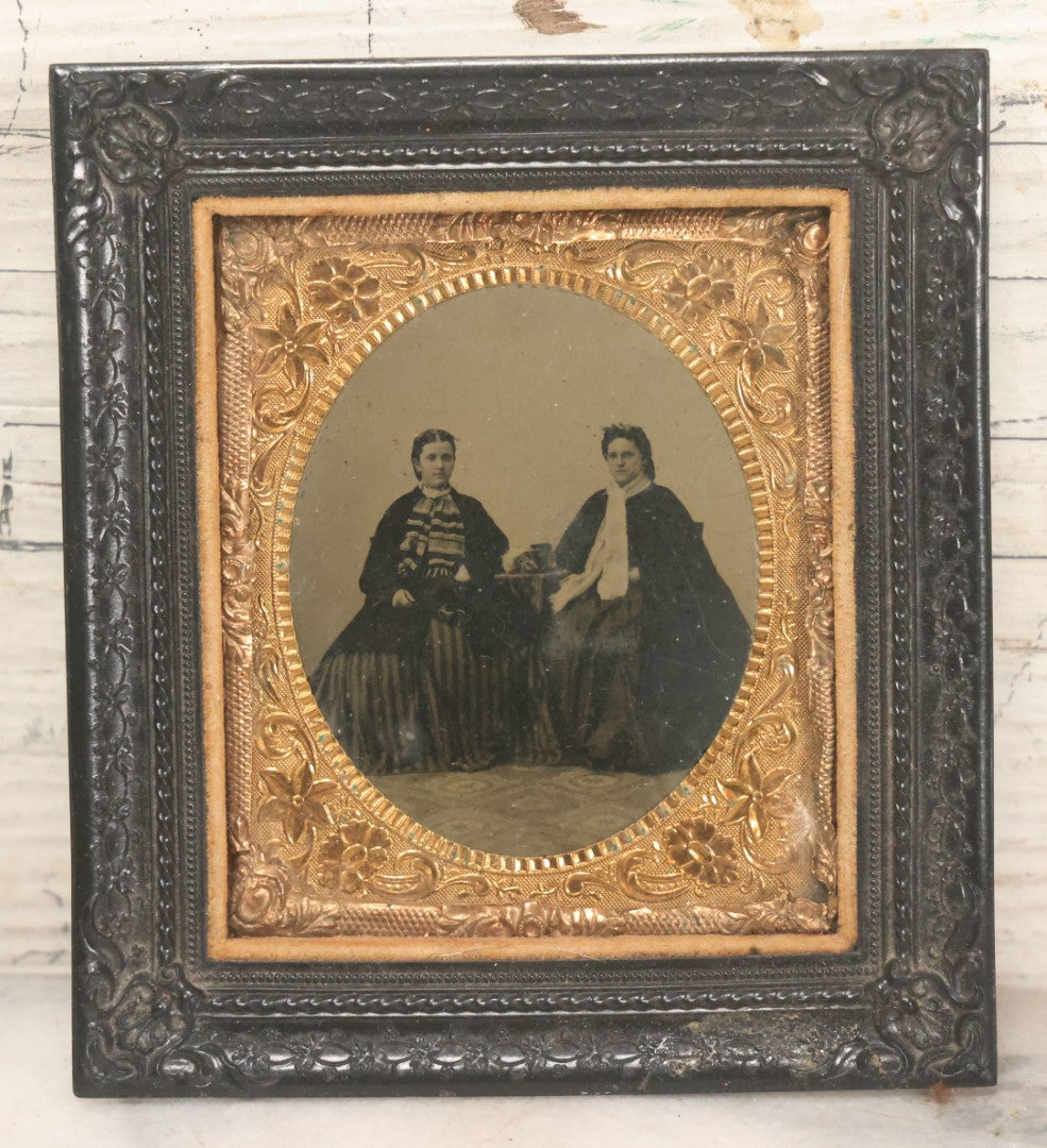 Lot 120 - Antique 1/6th Plate Tintype Photograph Of Two Ladies Seated At Table In Period Thermoplastic Frame With Hanging Hook, 4-1/8" x 4-5/8"