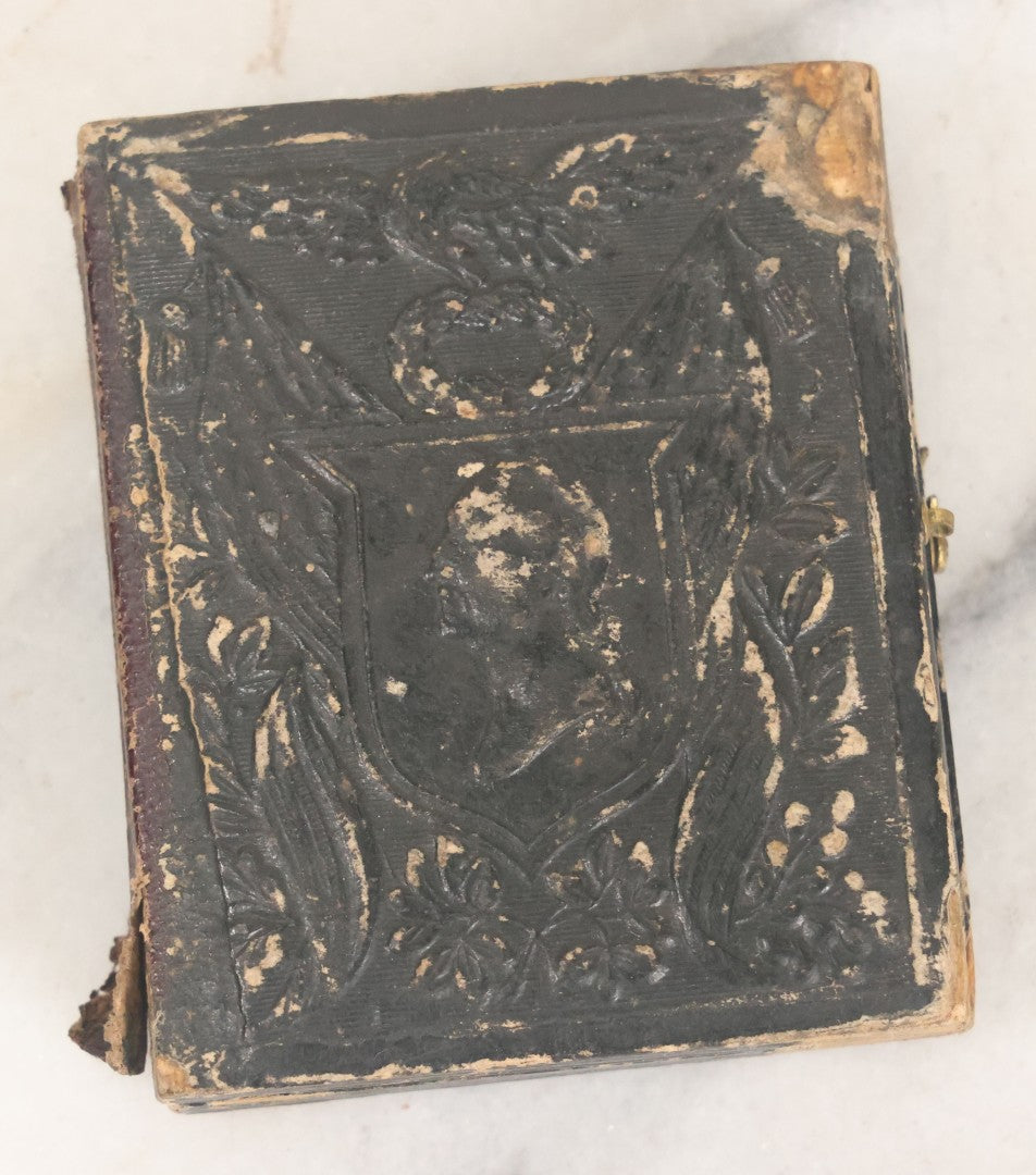 Lot 121 - Antique 1/9th Plate Tintype Photograph Of Pretty Young Girl Wearing Elaborate Scarf In Leatherette Case With George Washington Bust, American Flags, Eagle, And Laurel Crown, Note Heavy Wear And Tear