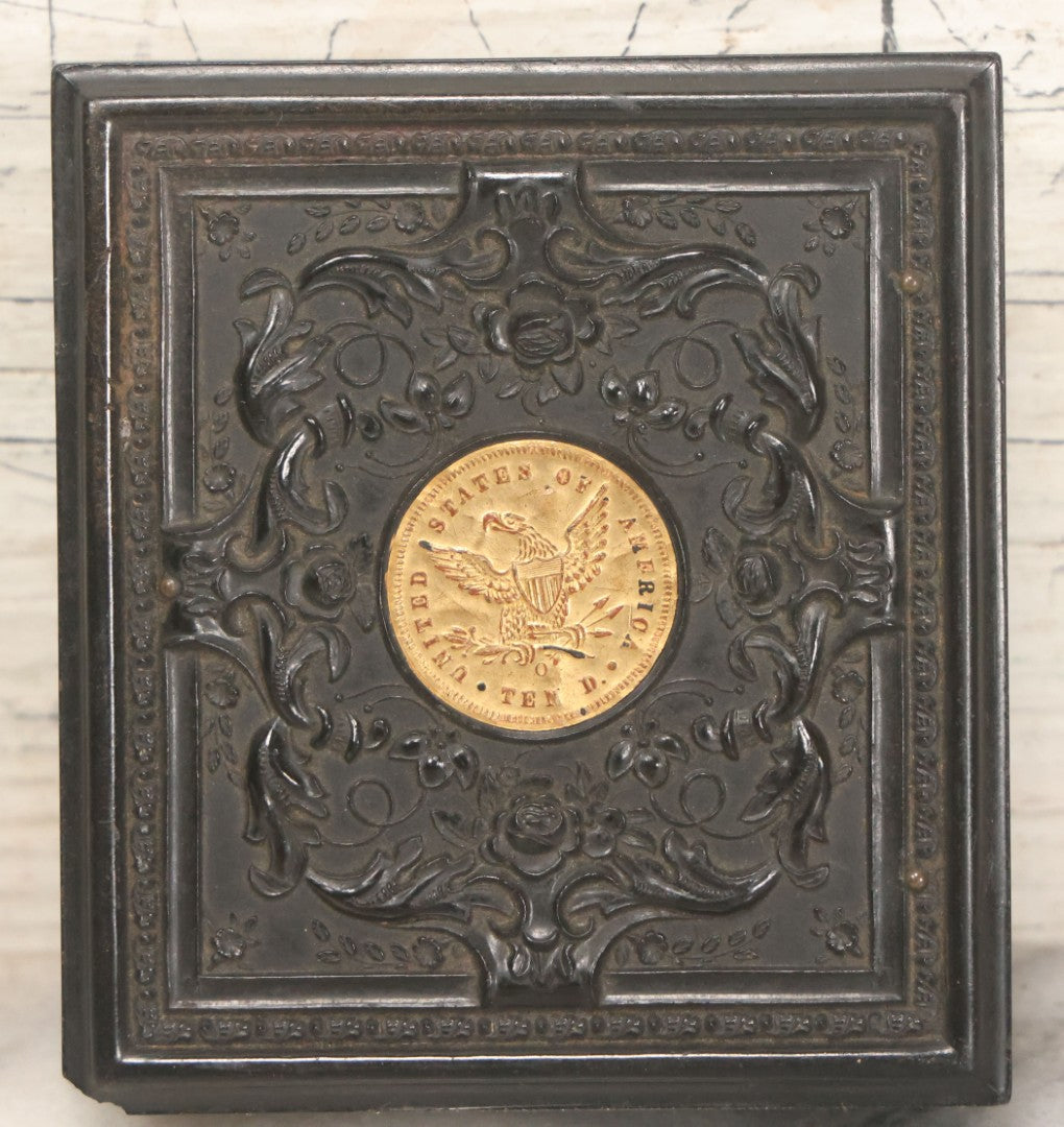 Lot 122 - Antique 1/6th Plate Hard Image Thermoplastic Case With Patriotic Motif, United States Of America Seal With Eagle, Faux Ten Dollar Coin, Genuine Union Case, By S. Peck & H. Halverson, Circa 1860