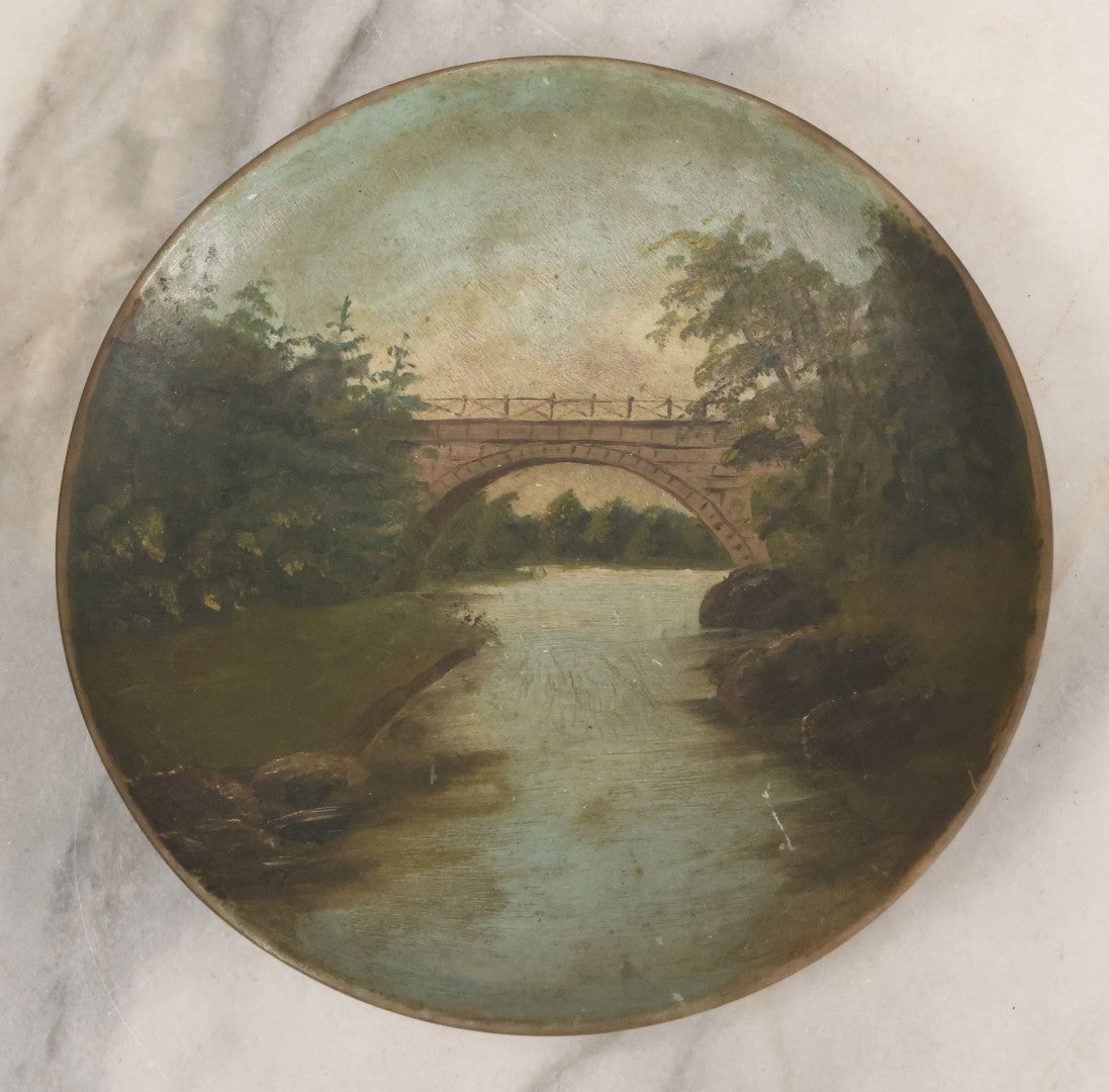 Lot 018 - Antique Hand Painted Milk Glass Plate Depicting The Echo Bridge, Stone Masonry Arch Bridge Across The Charles River, Newton Upper Falls & Needham, Massachusetts, Dated 1913, 6-1/2" Diameter