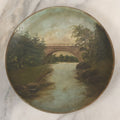 Lot 018 - Antique Hand Painted Milk Glass Plate Depicting The Echo Bridge, Stone Masonry Arch Bridge Across The Charles River, Newton Upper Falls & Needham, Massachusetts, Dated 1913, 6-1/2" Diameter