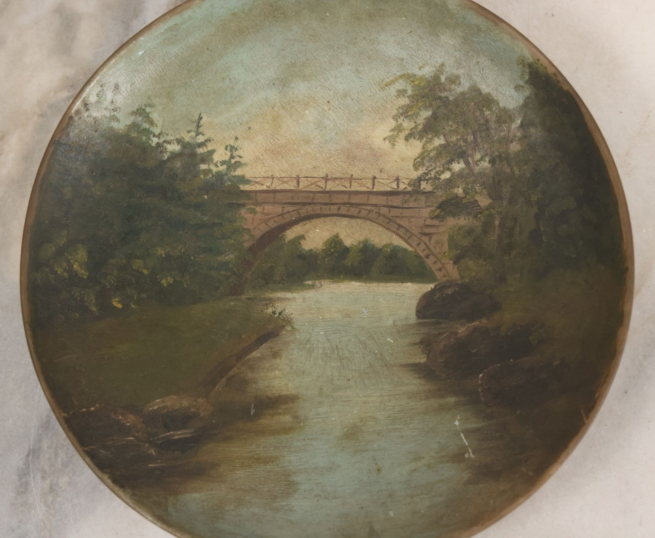 Lot 018 - Antique Hand Painted Milk Glass Plate Depicting The Echo Bridge, Stone Masonry Arch Bridge Across The Charles River, Newton Upper Falls & Needham, Massachusetts, Dated 1913, 6-1/2" Diameter
