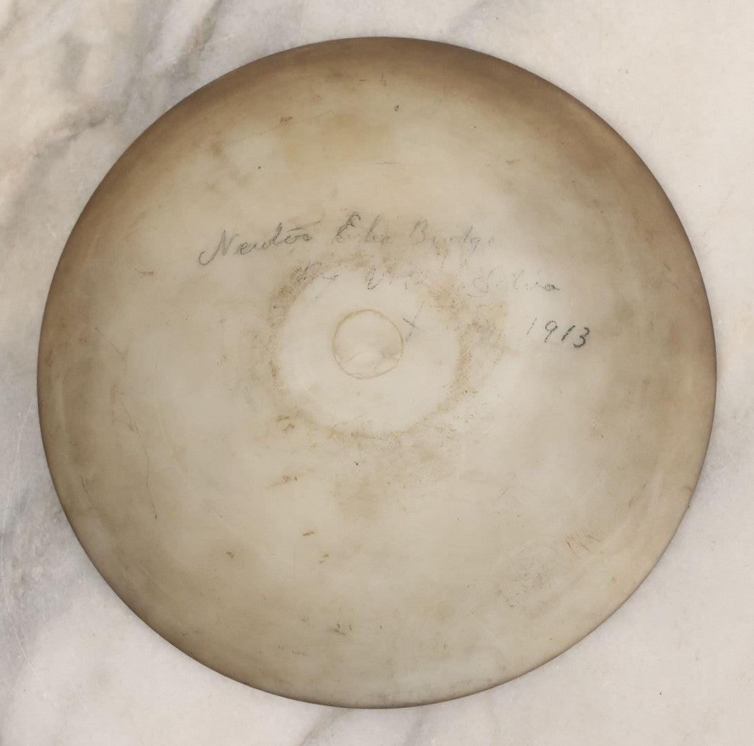 Lot 018 - Antique Hand Painted Milk Glass Plate Depicting The Echo Bridge, Stone Masonry Arch Bridge Across The Charles River, Newton Upper Falls & Needham, Massachusetts, Dated 1913, 6-1/2" Diameter