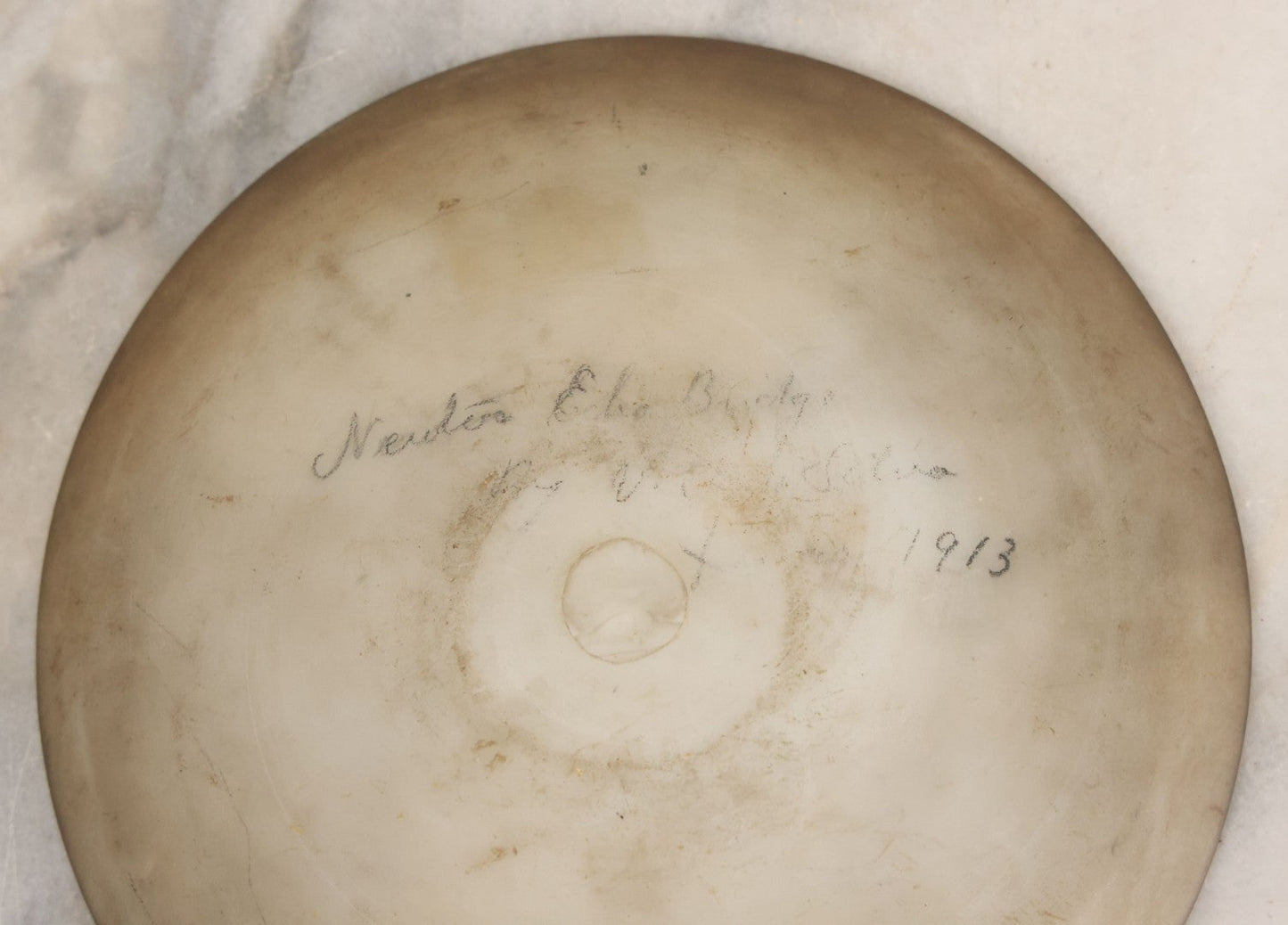 Lot 018 - Antique Hand Painted Milk Glass Plate Depicting The Echo Bridge, Stone Masonry Arch Bridge Across The Charles River, Newton Upper Falls & Needham, Massachusetts, Dated 1913, 6-1/2" Diameter