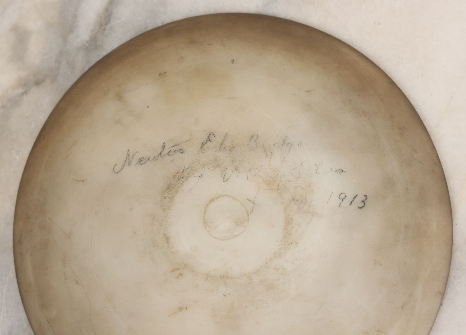 Lot 018 - Antique Hand Painted Milk Glass Plate Depicting The Echo Bridge, Stone Masonry Arch Bridge Across The Charles River, Newton Upper Falls & Needham, Massachusetts, Dated 1913, 6-1/2" Diameter