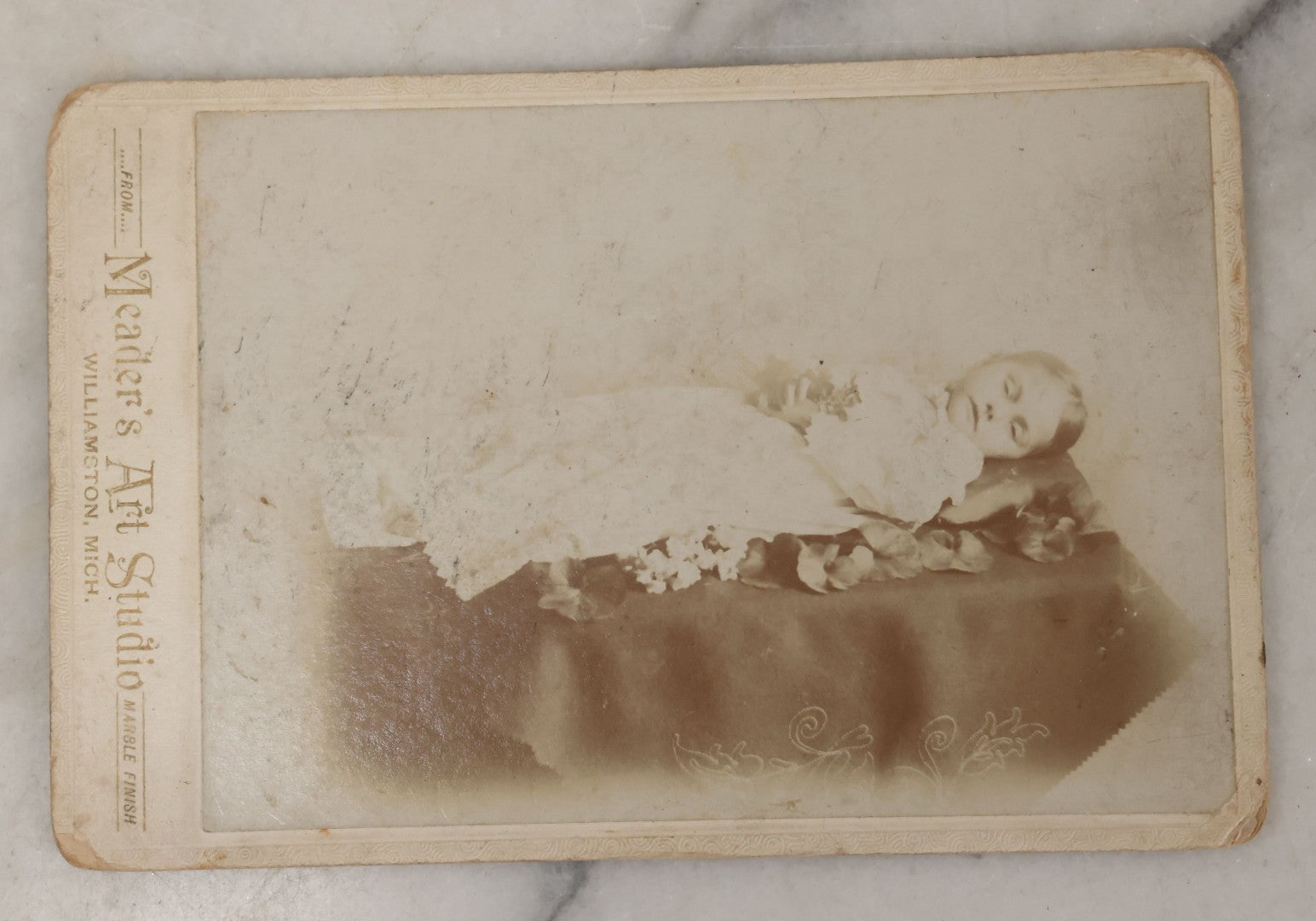 Lot 026 - Antique Cabinet Card Postmortem Photograph Of Young Girl On Funeral Table, Identified As Bernice Taylor, Granddaughter Of Arnold Johnson, From Meader's Art Studio, Williamston, Michigan