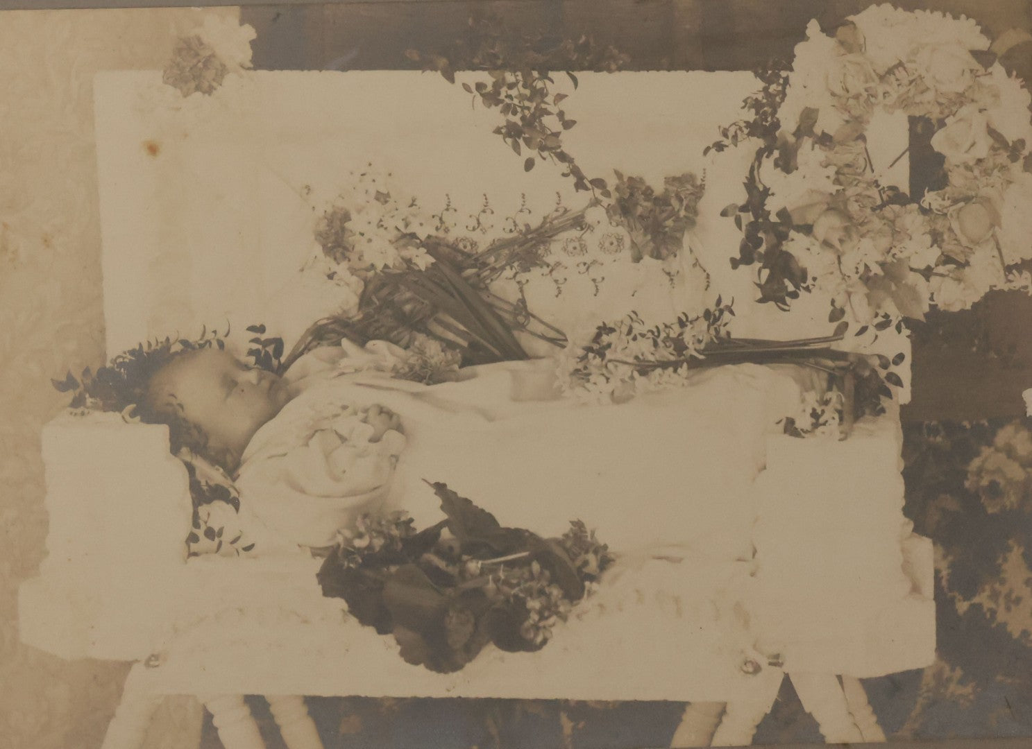 Lot 029 - Antique Boarded Post Mortem Photograph Of Baby In White Childs Coffin With Flowers