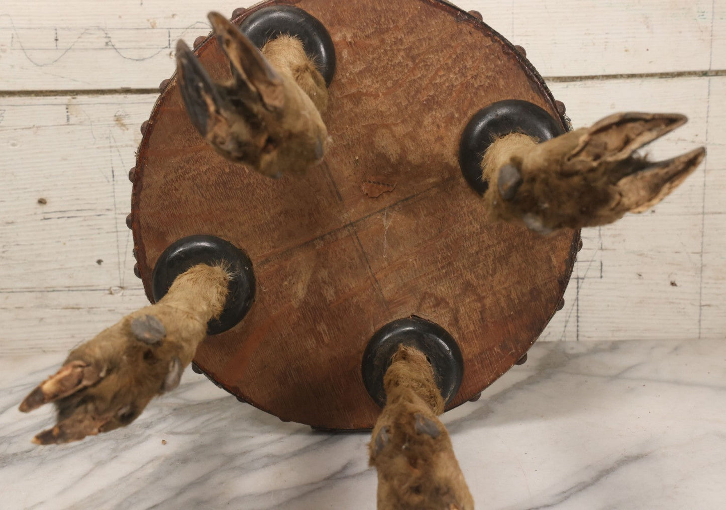 Lot 042 - Vintage Deer Leg And Hoof Taxidermy Foot Stool With Original Fabric Upholstery, Four Deer Legs, Note One Leg Missing Hoof Claw