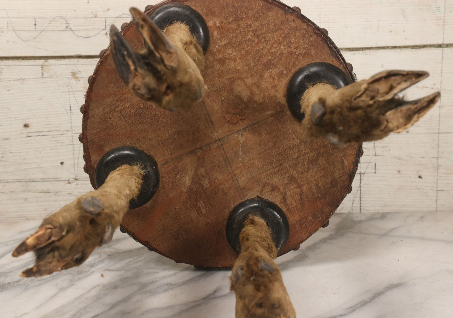 Lot 042 - Vintage Deer Leg And Hoof Taxidermy Foot Stool With Original Fabric Upholstery, Four Deer Legs, Note One Leg Missing Hoof Claw