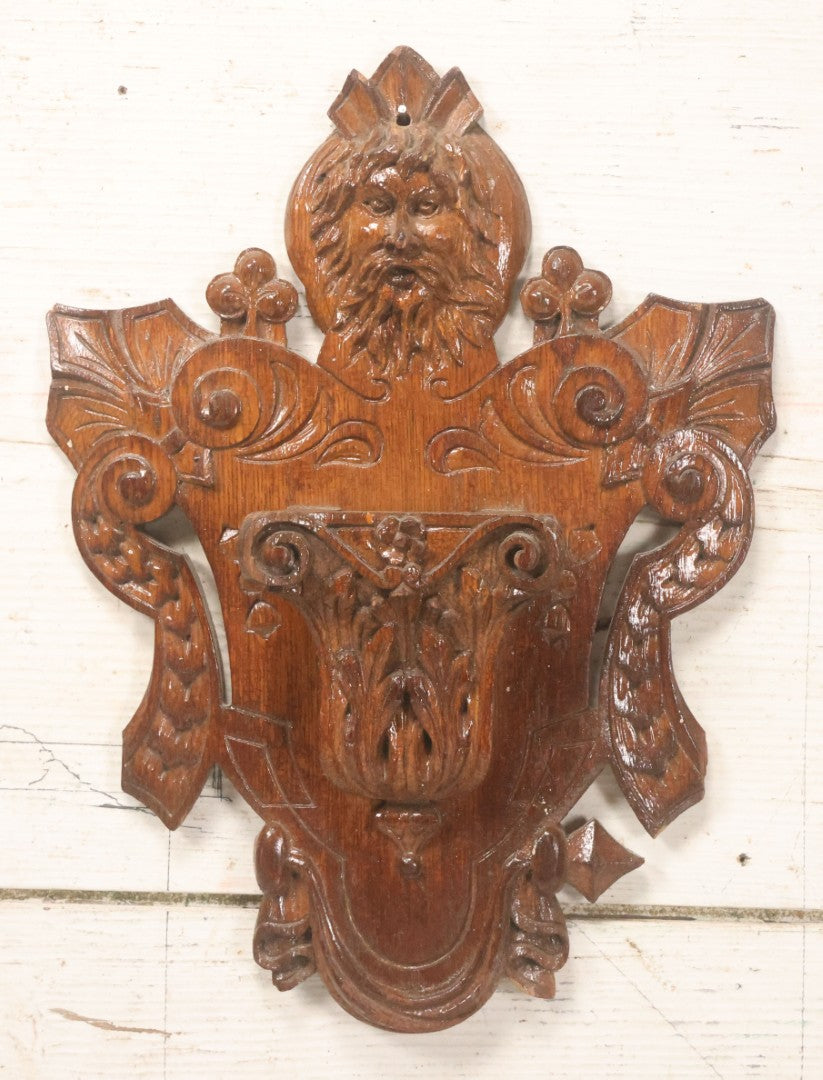 Lot 043 - Antique Hand Carved Black Forest Style Wall Pocket Plaque With Greenman Face Motif, Likely European, Baroque And Rococo Influenced Design, 8-3/4" x 11-7/8"