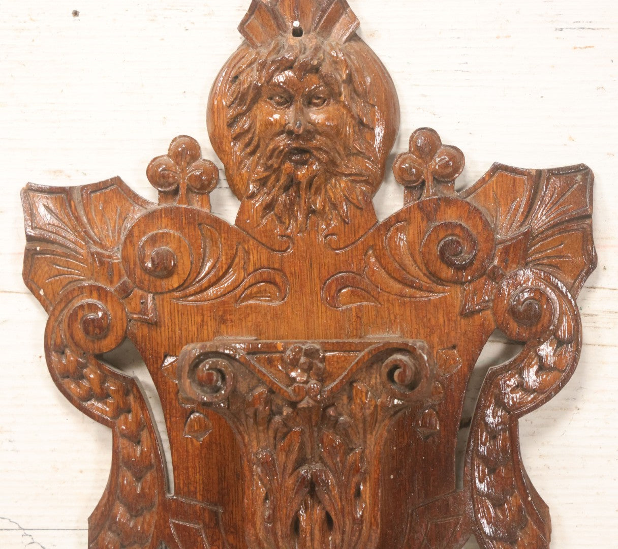Lot 043 - Antique Hand Carved Black Forest Style Wall Pocket Plaque With Greenman Face Motif, Likely European, Baroque And Rococo Influenced Design, 8-3/4" x 11-7/8"