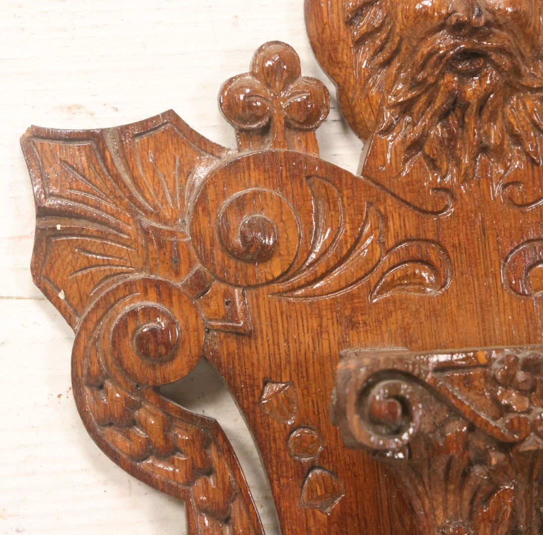 Lot 043 - Antique Hand Carved Black Forest Style Wall Pocket Plaque With Greenman Face Motif, Likely European, Baroque And Rococo Influenced Design, 8-3/4" x 11-7/8"