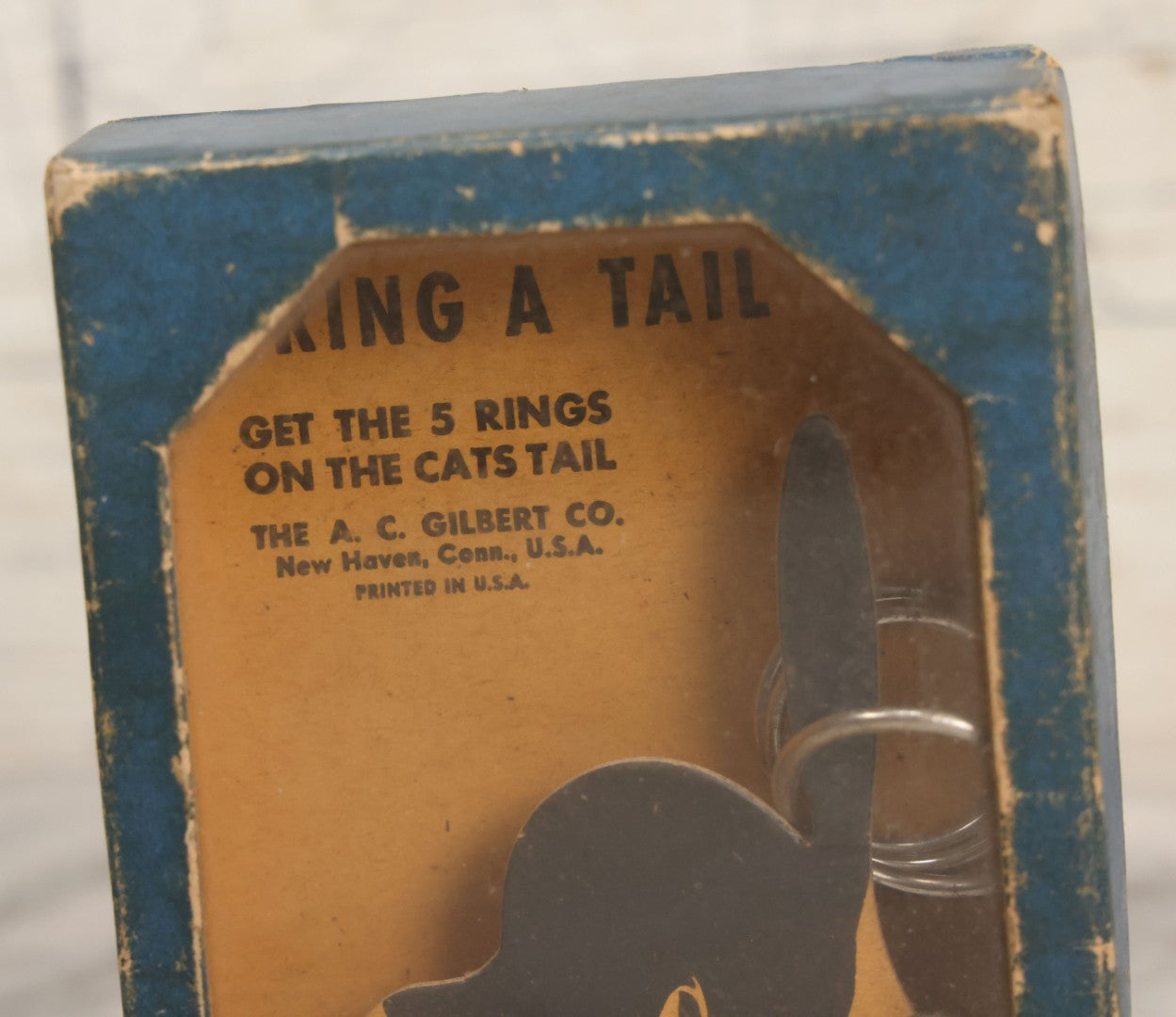 Lot 047 - Vintage "Ring A Tail" Black Cat Dexterity Game, "Get The Five Rings On The Cats Tail," Manufactured By The A.C. Gilbert Company, New Haven, Connecticut, Printed In U.S.A.