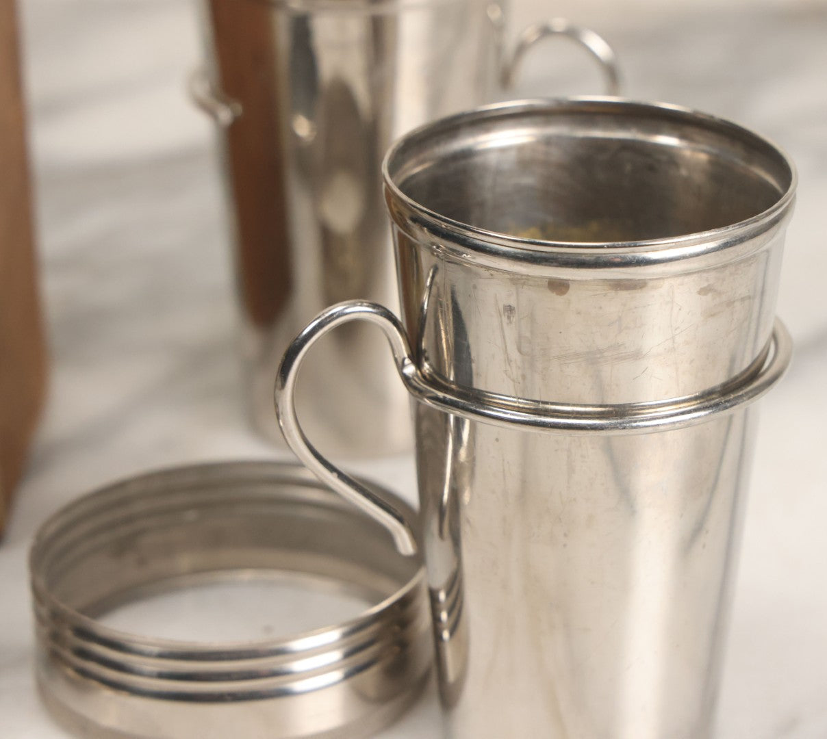 Lot 048 - Antique Thermos Brand Thermo Cup Set Of Four Plain Nickel Cups No. 79, With Original Box With Devil Graphics, Manufactured By The American Thermos Bottle Co., New York, Patented 1912, Complete Set