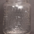 Lot 050 - Antique "Shull's Electric Cream" Patent Medicine Glass Jar Bottle With Face With Lightning Bolts Embossed Graphics, W.S. Monogram On Bottom, Note Chip On Rim