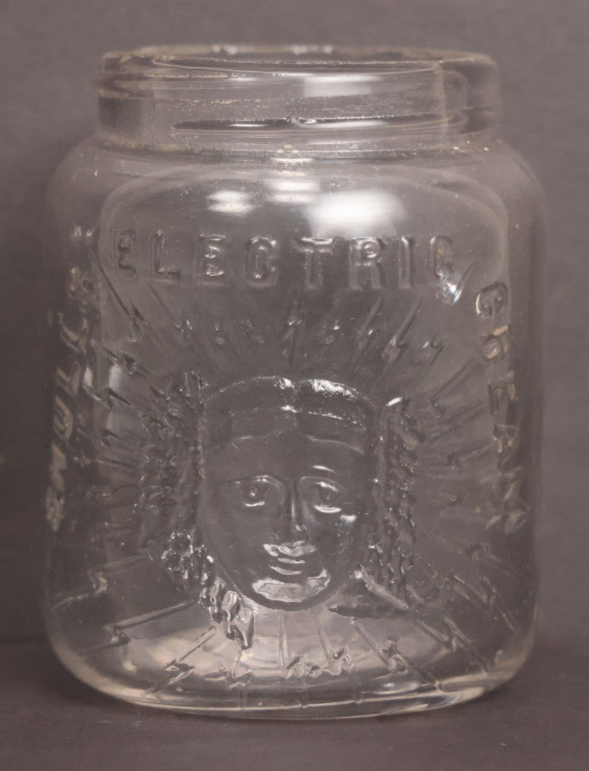 Lot 050 - Antique "Shull's Electric Cream" Patent Medicine Glass Jar Bottle With Face With Lightning Bolts Embossed Graphics, W.S. Monogram On Bottom, Note Chip On Rim