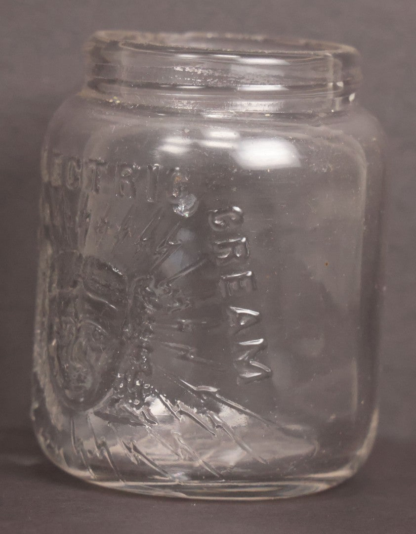 Lot 050 - Antique "Shull's Electric Cream" Patent Medicine Glass Jar Bottle With Face With Lightning Bolts Embossed Graphics, W.S. Monogram On Bottom, Note Chip On Rim