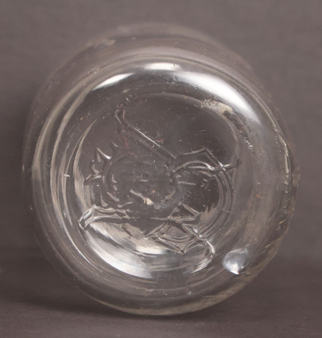 Lot 050 - Antique "Shull's Electric Cream" Patent Medicine Glass Jar Bottle With Face With Lightning Bolts Embossed Graphics, W.S. Monogram On Bottom, Note Chip On Rim