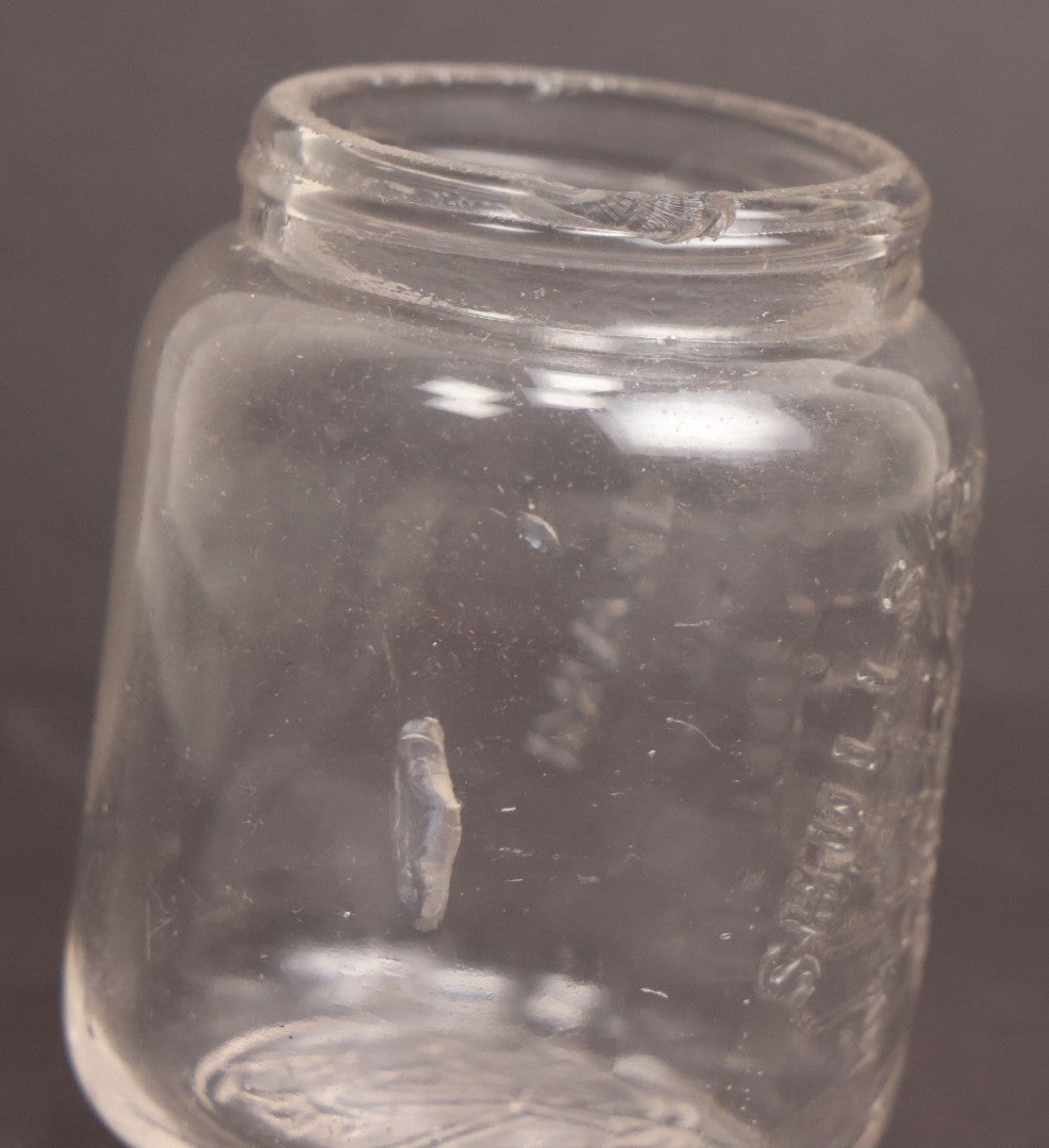 Lot 050 - Antique "Shull's Electric Cream" Patent Medicine Glass Jar Bottle With Face With Lightning Bolts Embossed Graphics, W.S. Monogram On Bottom, Note Chip On Rim