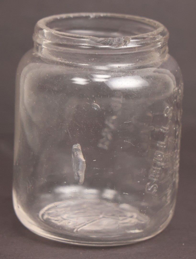 Lot 050 - Antique "Shull's Electric Cream" Patent Medicine Glass Jar Bottle With Face With Lightning Bolts Embossed Graphics, W.S. Monogram On Bottom, Note Chip On Rim
