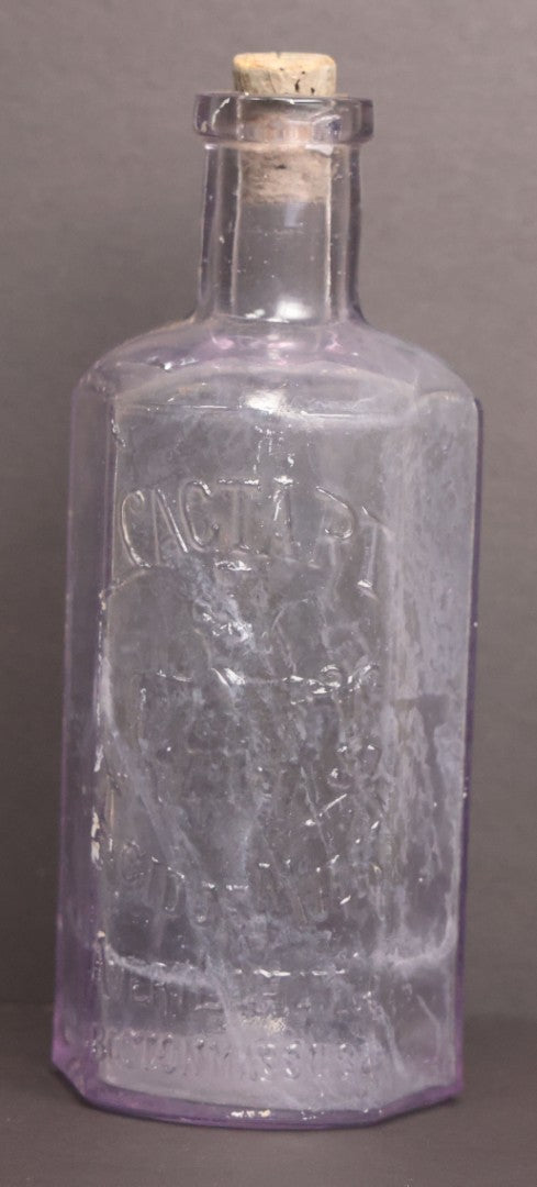 Lot 051 - Antique "Lactart" Acid Of Milk Purple Glass Medicine Bottle, Avery Lactate Co., Boston, Massachusetts, With Milkmaid And Cow Graphics