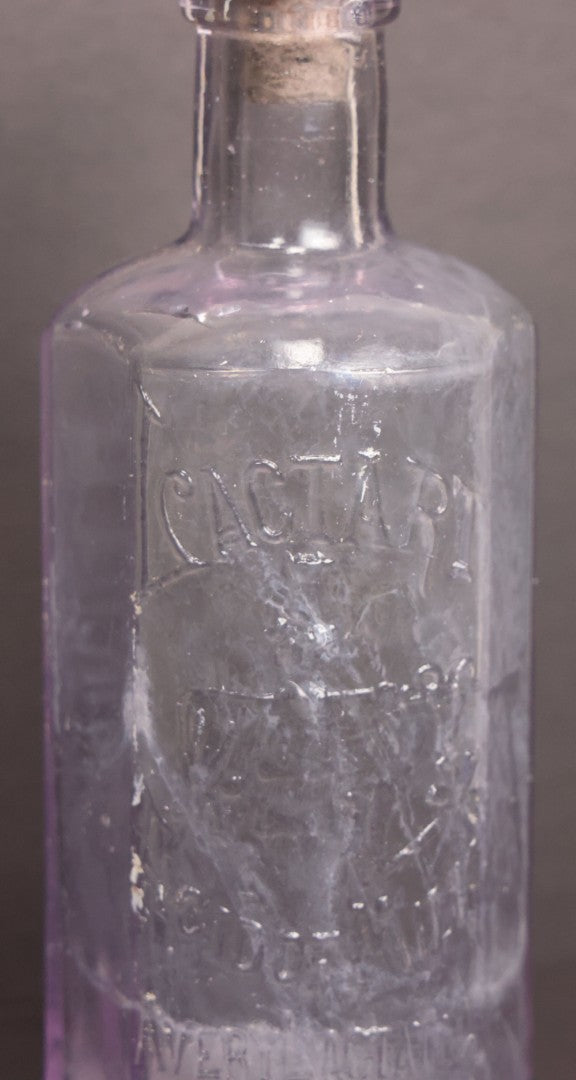 Lot 051 - Antique "Lactart" Acid Of Milk Purple Glass Medicine Bottle, Avery Lactate Co., Boston, Massachusetts, With Milkmaid And Cow Graphics